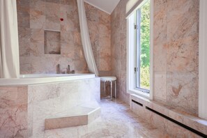 Combined shower/tub, hair dryer, towels, soap