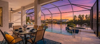 Waterfront Cape Coral villa with 4 bedrooms, pool, spa, and canal access.