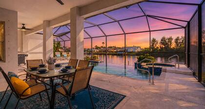 Waterfront Cape Coral villa with 4 bedrooms, pool, spa, and canal access.