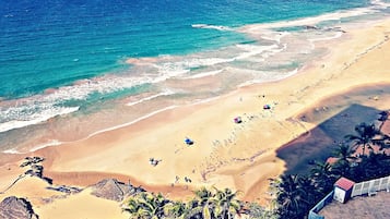 On the beach, sun-loungers, beach towels