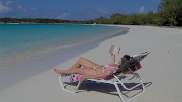 On the beach, sun loungers, beach towels