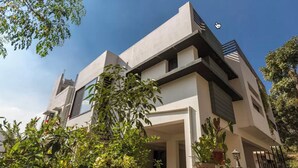 A modern two-story building with a flat roof and large windows. - Ultra modern bungalow in Jakkur (Bengaluru)