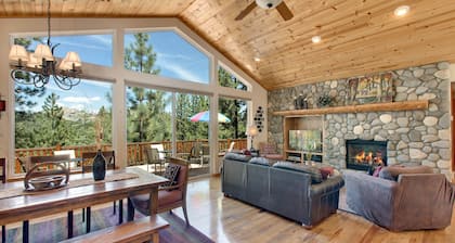 Indoor heated pool, spacious deck, seven rooms with beds, hot tub, and more!