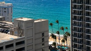 A high-rise hotel overlooking a beach with a clear view of the ocean. - Amazing, OCEAN VIEW STUDIO - BALCONY- Wi-Fi -APT has GENERATOR- PARKING Optional (Condado, San Juan)