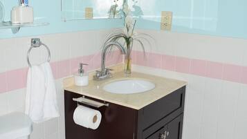 Bathtub, hair dryer, towels