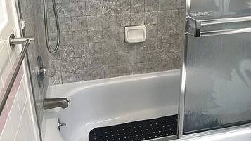 Bathtub, hair dryer, towels