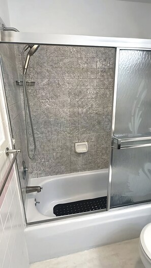 Bathtub, hair dryer, towels