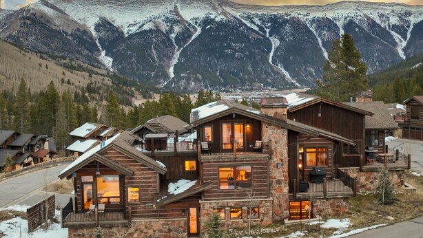 A log cabin-style hotel with multiple levels, stone accents, and large windows. - Retreat at Union Creek II:  Easy Walk to Lift, Hot Tub, Foosball, Shuttle (Copper Mountain)