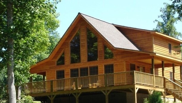 A wooden cabin with a balcony and large windows. - Romantic Mountain Chalet with Stream & Gazebo   (Murphy)