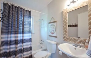 Combined shower/tub, hair dryer, towels, soap