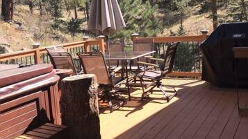 Enjoy al fresco dining on the deck, which offers a grill and comfortable seating for a relaxing meal.