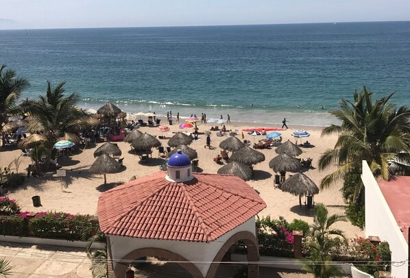 On the beach, sun-loungers, beach towels