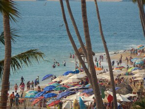 On the beach, sun-loungers, beach towels