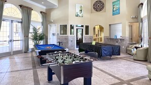 A spacious lobby with a foosball table, a pool table, and a billiards table. - LAKEVIEW from Your Private Pool! - Relax & Create Memories - Resort Near Disney! (Davenport)