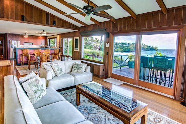 Living room with view of Honolii Beach in background
