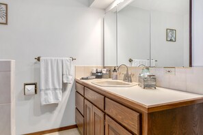 Bathtub, hair dryer, towels