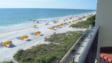 On the beach, sun loungers, beach towels