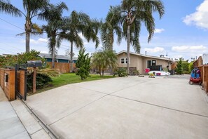 Private and gated driveway parking for 2 vehicles comfortably but it can fit 3.