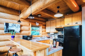 Fridge, microwave, oven, stovetop - Creekside Cabin with Private Hot Tub & Wood Stove (Black Hawk)