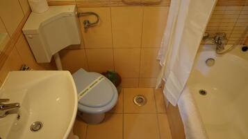 Bathtub, hair dryer, towels