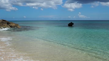 On the beach, sun-loungers, beach towels