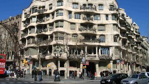 A multi-story building with balconies and a unique architectural style. - Close Gaudi, Gracia equipped apartment, Barcelona, WIFI, balcony, AC & elevator (Barcelona)