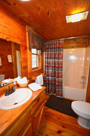 Combined shower/tub, hair dryer, towels, soap