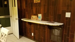 A reception area with a wooden wall, a reception desk, a door, and a chair. - Mountain Top Retreat, 116 private acres (Hobart)