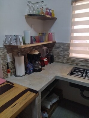 Fridge, microwave, stovetop, coffee/tea maker