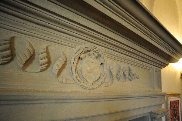 A detailed stone carving on a mantelpiece. - Luxury Renaissance Palace (Firenze)