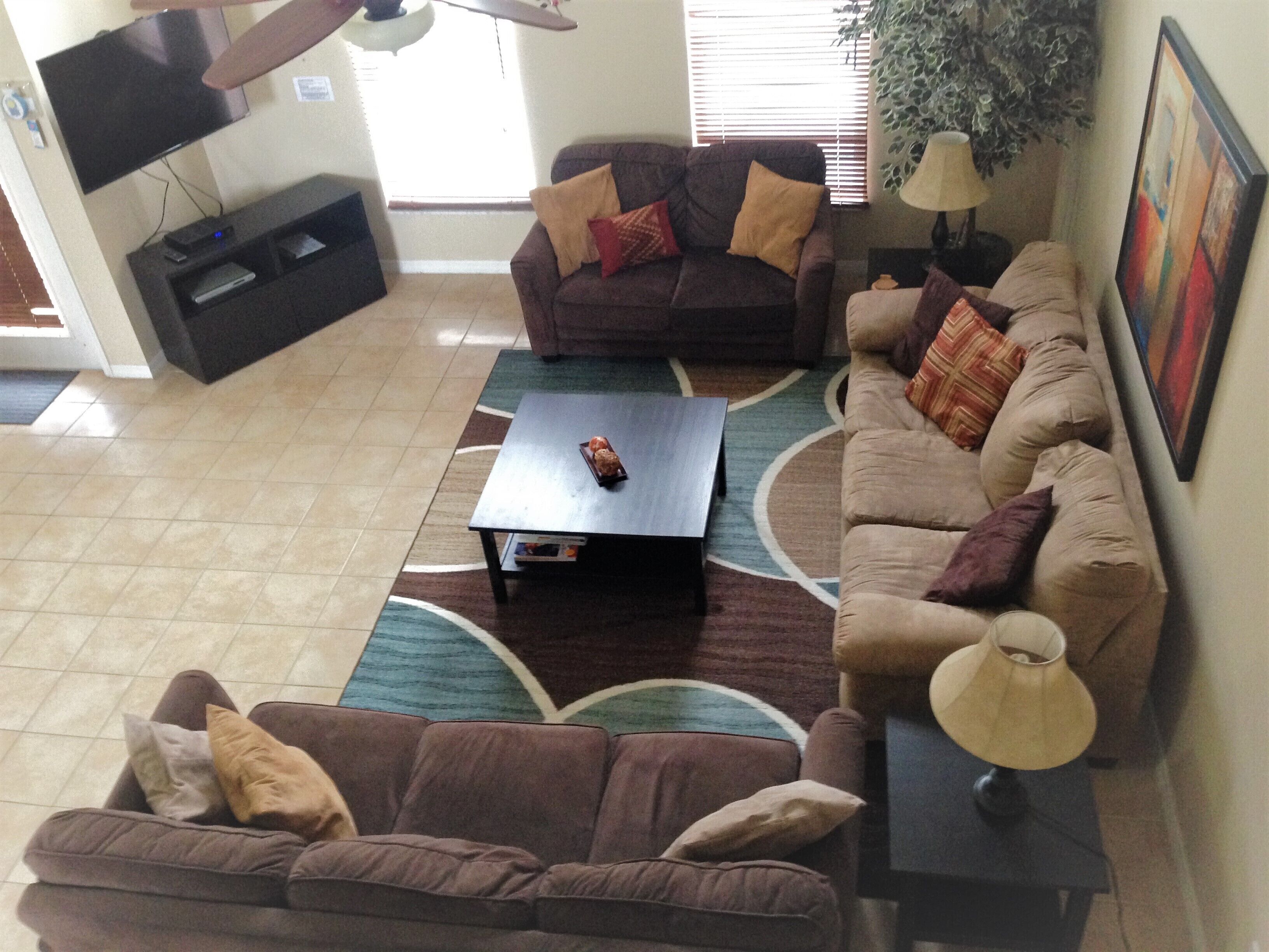 A living room with two sofas, a coffee table, and a TV.