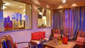 A cozy living room with a sofa, chairs, a coffee table, and a large mirror reflecting the room. -  SW STYLE/BREATHTAKING VIEWS & 8 Min. to OLD TWN~WOW REVIEWS/Long Term SPECIALS  (Albuquerque)