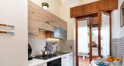 Waterfront apartment with garden and wide sea view