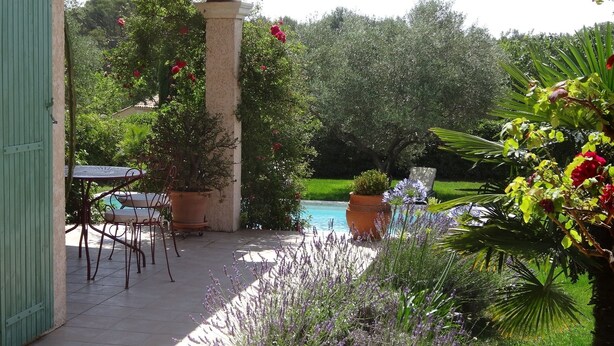 A patio with a pool, surrounded by potted plants and a table with chairs. - House / Villa - Uzès (Uzès)