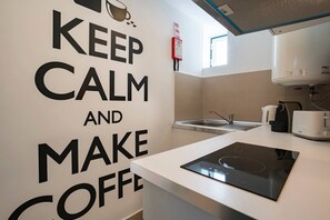 Fridge, microwave, stovetop, coffee/tea maker