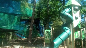 A playground with a slide and climbing structures. - Log Cabin On Shores Of Lake Windermere, Surrounded By Breathtaking Scenery (Windermere)