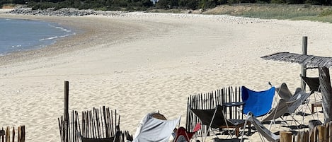 On the beach, sun loungers