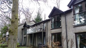 A two-story house with a balcony, a garden, and a tree. - Paradise in the Lake District. (Skelwith Bridge, Ambleside)