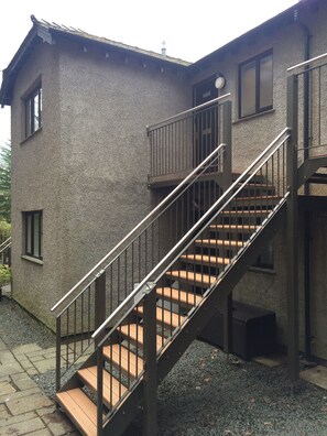 For the flat, go up the stairs and it is on the left.