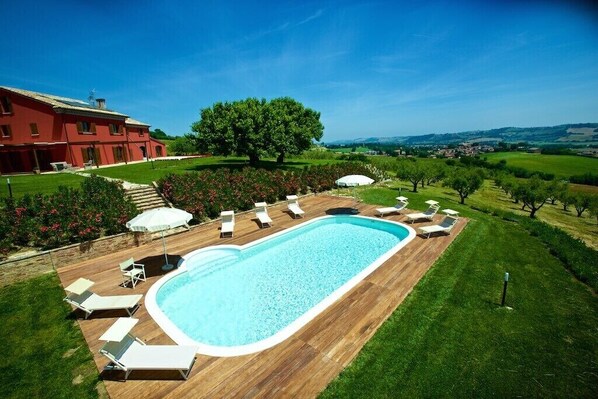 A heated pool, pool loungers