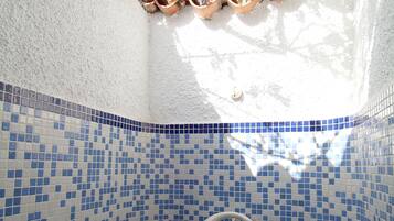 Combined shower/tub, hair dryer, towels, soap