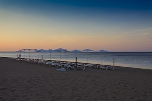 Beach nearby, sun loungers
