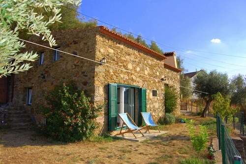 Tranquil stone cottage by lovely lake.