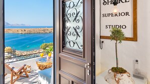 A hotel entrance with a view of the sea, a welcome sign, and a potted plant. - Brand New!!! Lindos shore Superior Studio just above Lindos main beach !!! (Rhodes)