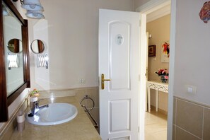 Bathtub, hair dryer, towels, soap