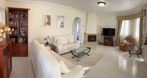 TV, fireplace, books, stereo