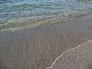 A beach with clear water and pebbly sand. - VILLETTA TO FORMATION WITH GARDEN 300MT FROM THE SEA (Pittulongu)