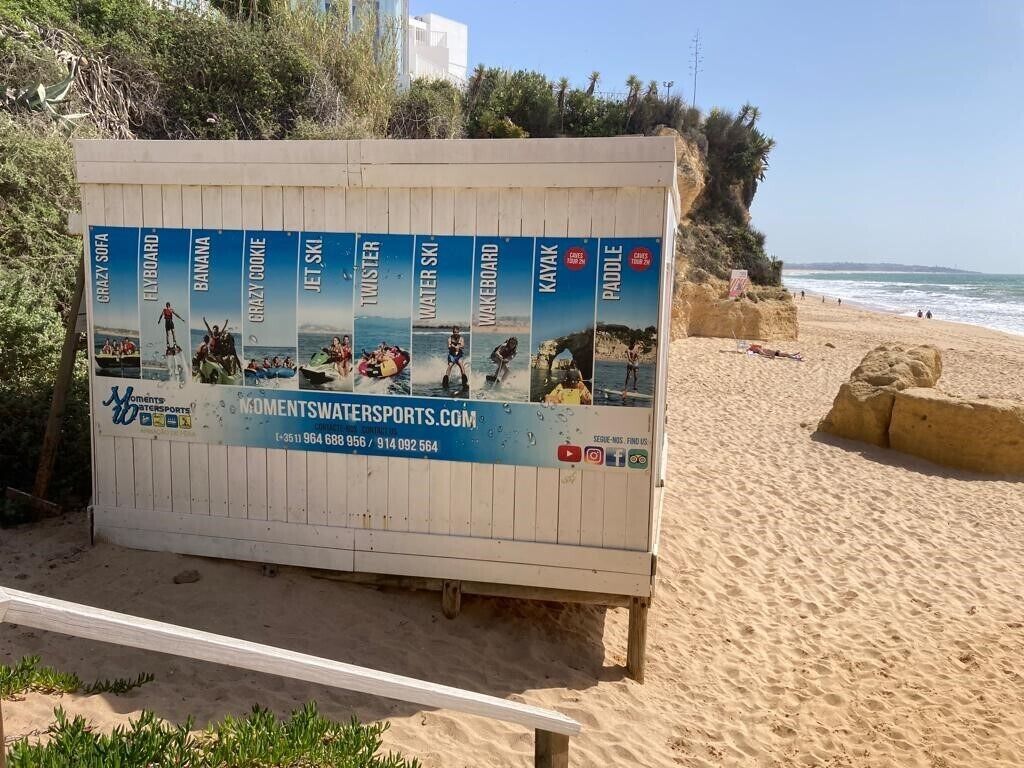 A beachside advertisement board for watersports.