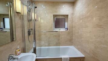 Combined shower/tub, hair dryer, towels, soap