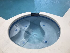 Outdoor pool, a heated pool, pool loungers